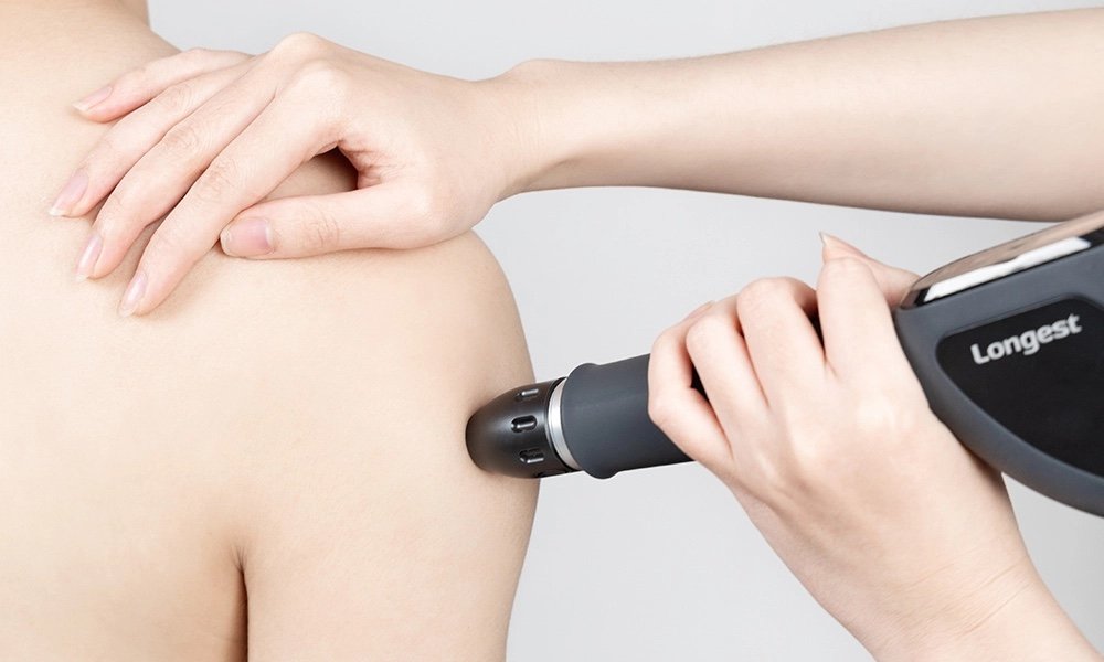 Shockwave therapy being applied to the shoulder